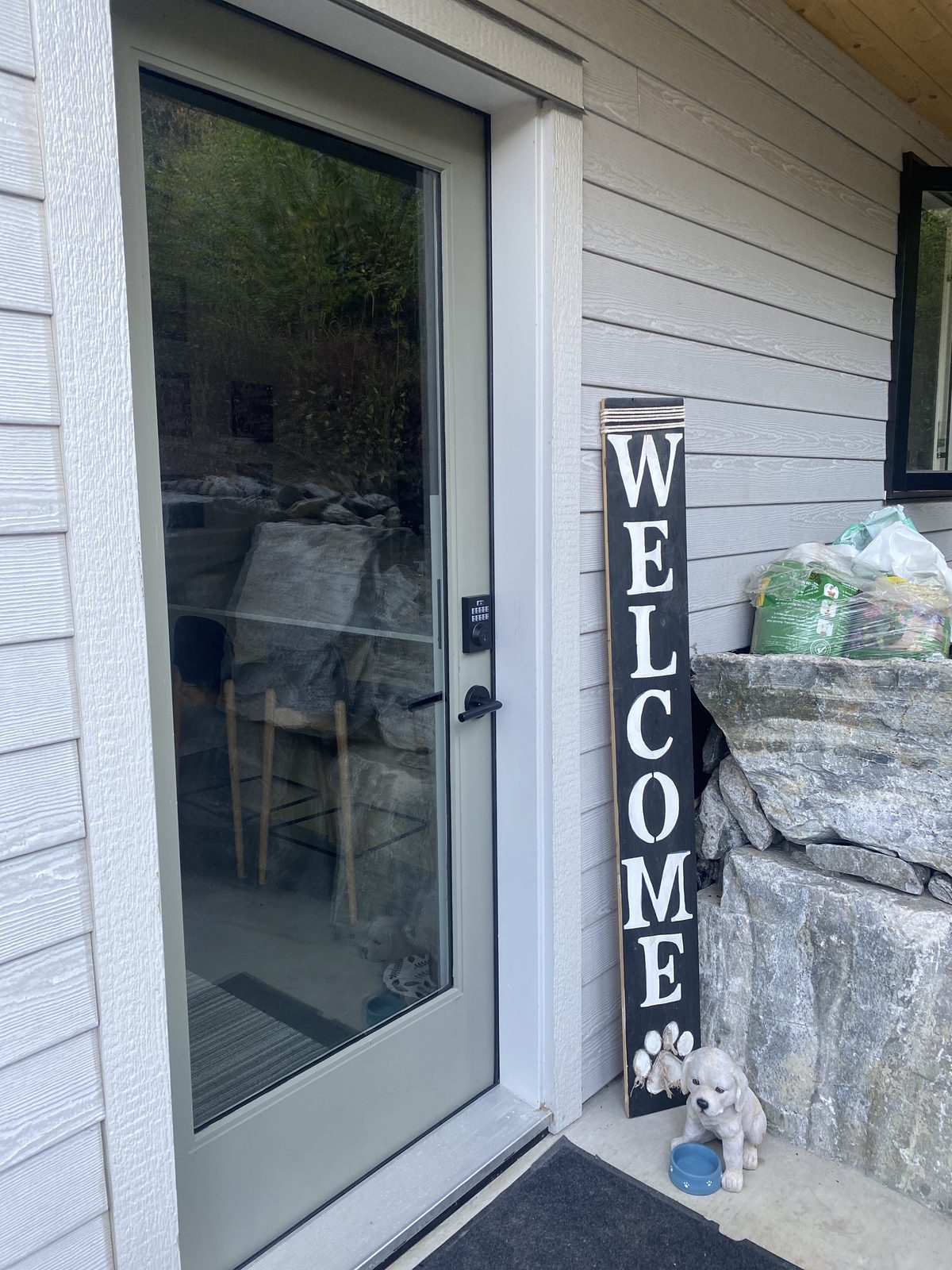 Front entrance glass window with a view into the living room, cleaned by Kendal