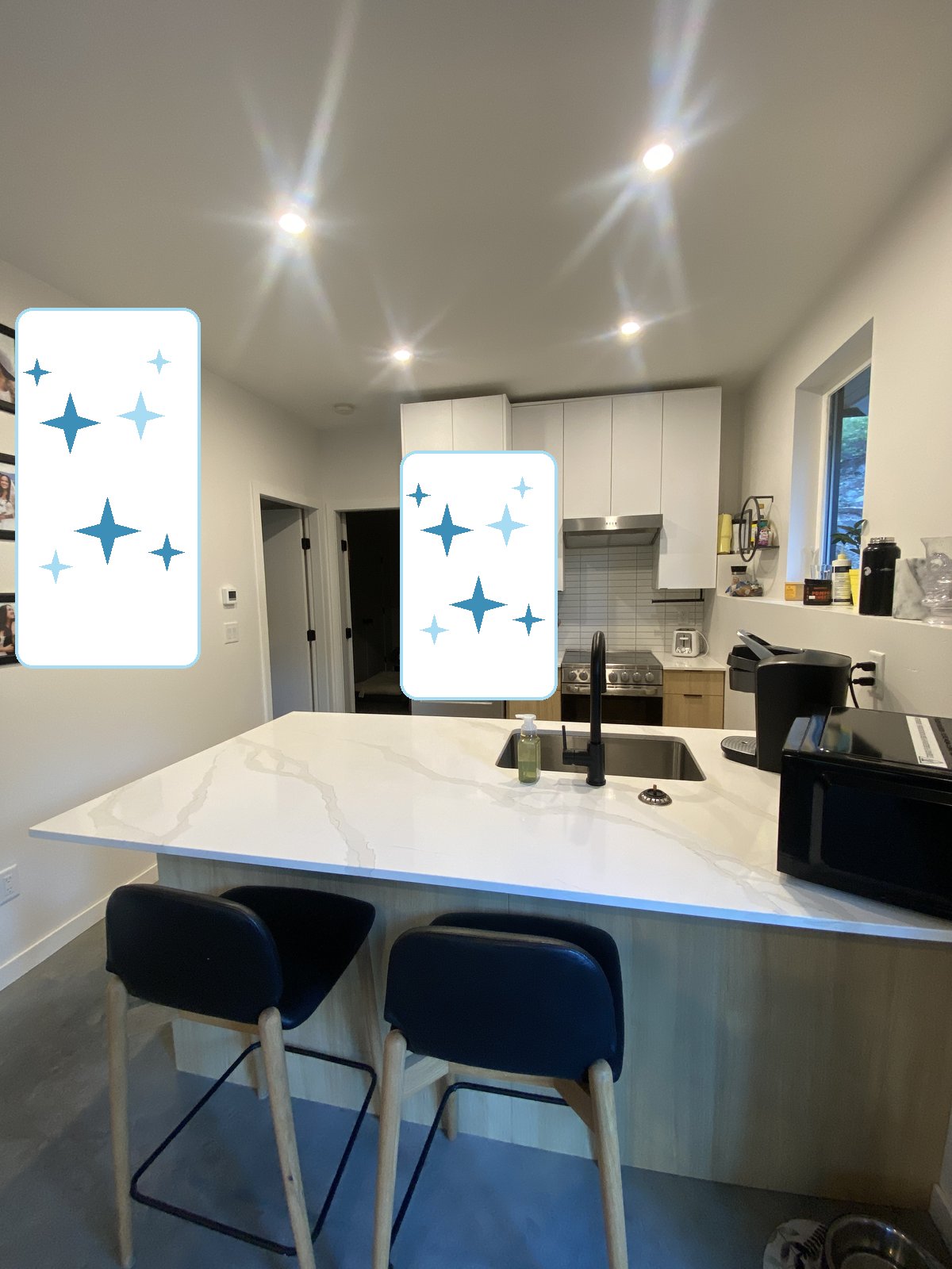 Kitchen island and counters wiped down and shining, cleaned by Kendal