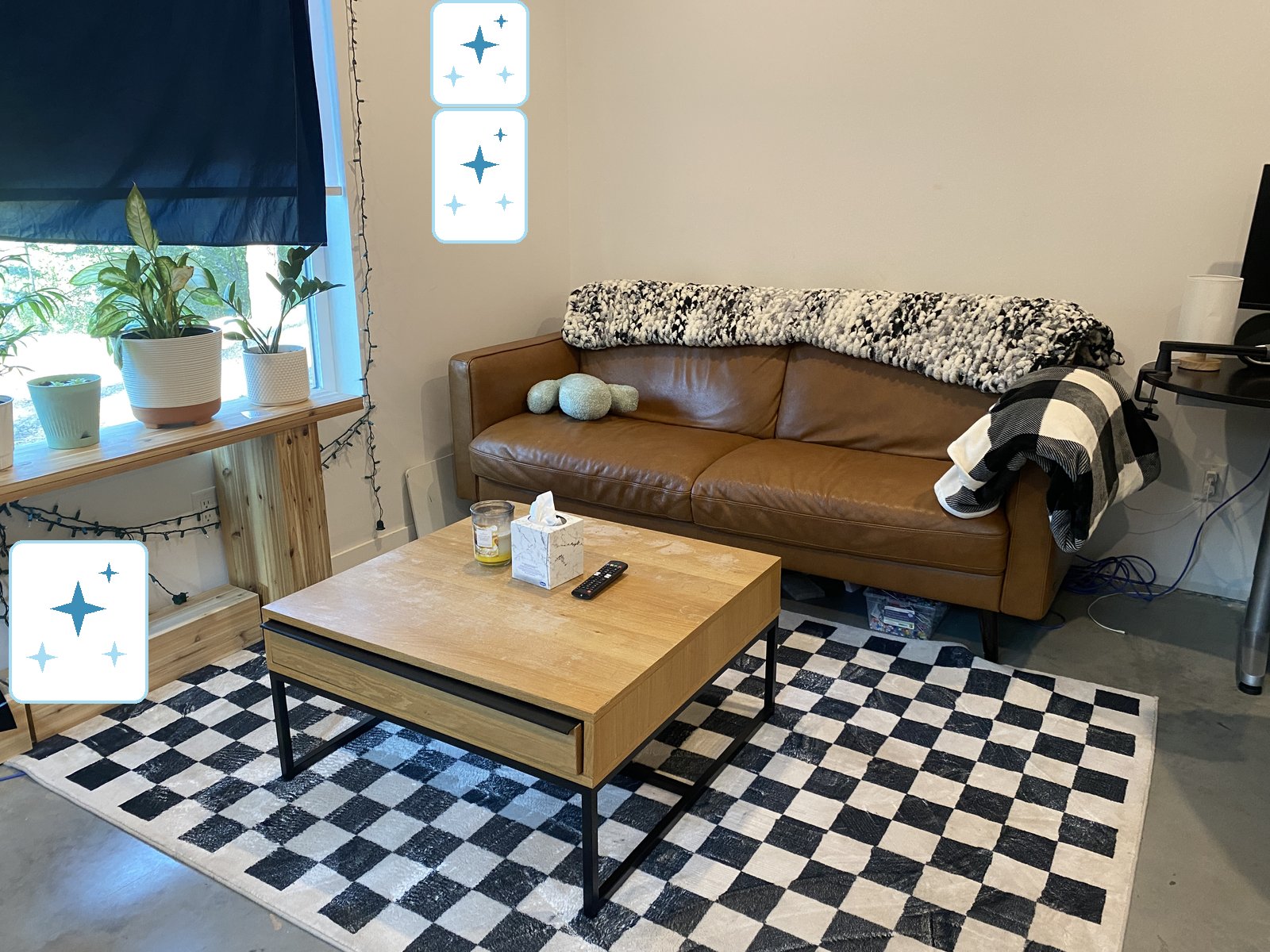 Living room reset with leather sofa and clean floors, cleaned by Kendal
