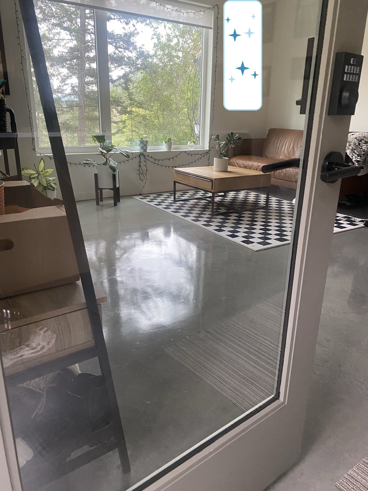 Sunroom seen through the doorway with spotless floors, cleaned by Kendal