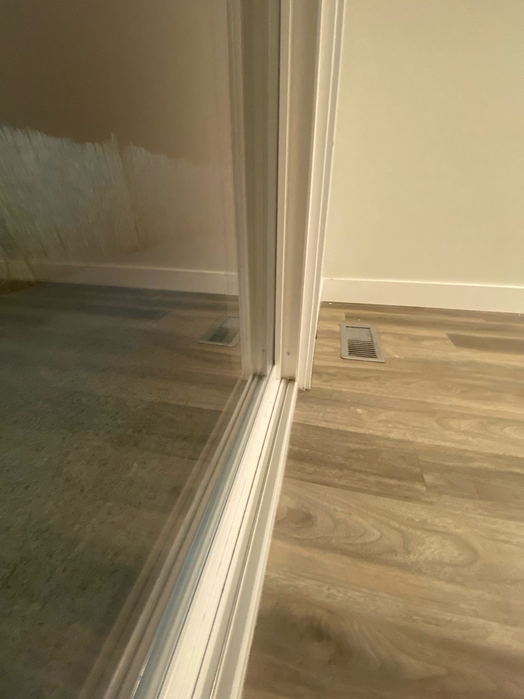 Mirrored closet doors with a freshly detailed sliding track, cleaned by Kendal